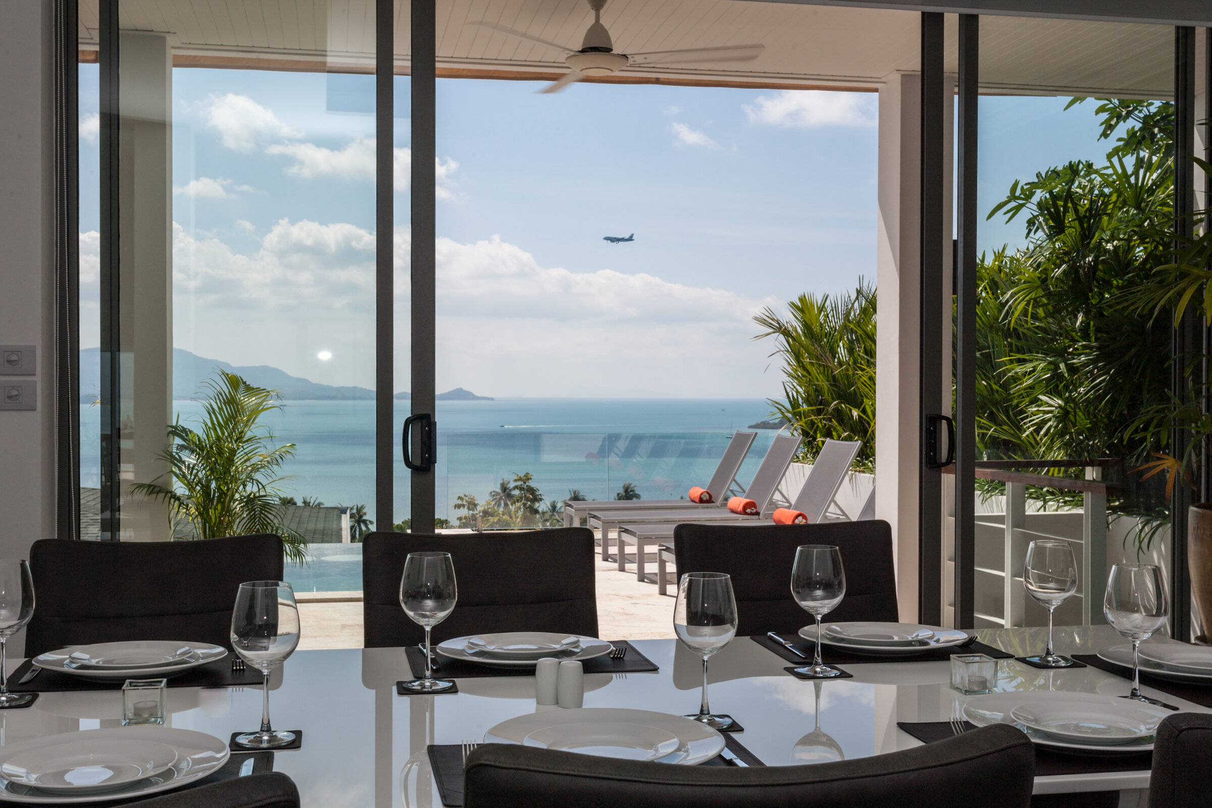 Villa Daizo elegant living room with floor-to-ceiling windows and sunset views